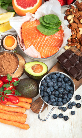 Food for healthy skin. Assortment of various natural food products high in vitamins and minerals for skin health. Nutrition for beautiful supple skin. Top view. Copy space.の写真素材