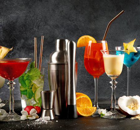 Summer cocktails in classic glasses on a black background. Party time. Tasty drinks. Copy spaceの写真素材