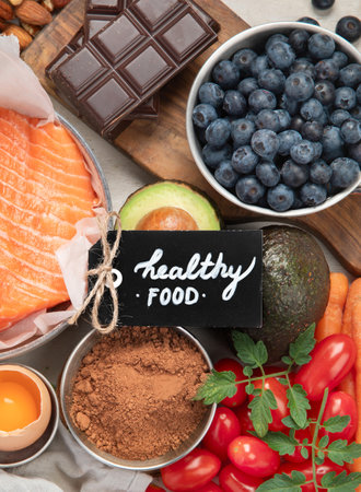 Food for healthy skin. Assortment of various natural food products high in vitamins and minerals for skin health. Nutrition for beautiful supple skin. Top view.の写真素材