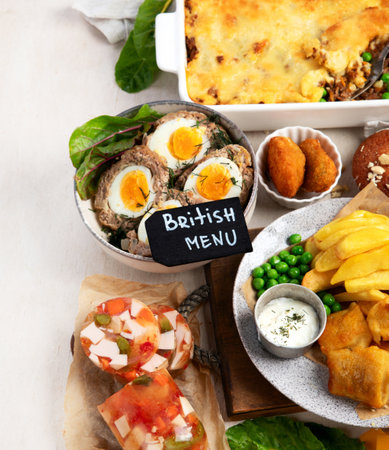 Variety of classic traditional British dishes. Meals good for lunch, snack and dinner on a light background. Top view. Copy space.の写真素材