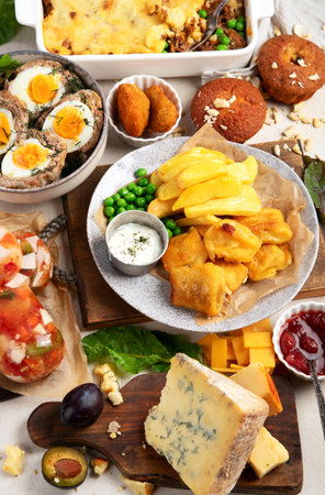 Variety of classic traditional British dishes. Meals good for lunch, snack and dinner on a light background. Top view.の写真素材
