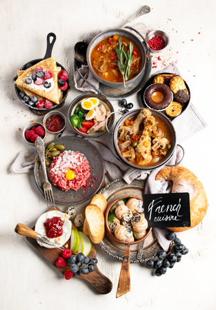 Traditional French food dishes, family dinner or lunch, View from above on light backgroundの写真素材