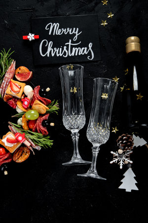 Christmas food background. Christmas wreath of holiday appetizer on a dark background, top view.の写真素材
