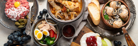 Traditional French food dishes, family dinner or lunch, View from above on light backgroundの写真素材