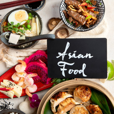 Assortment of traditional Asian food dishes on a light backgrount. Top view.の写真素材