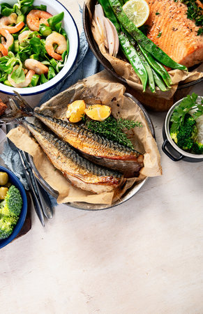 Assorted healthy seafood on plates for dinner or lunch. traditional mediterranean cuisine. Top view, copy space. High in vitamins and antioxidantsの写真素材
