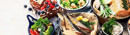Assorted healthy seafood on plates for dinner or lunch. traditional mediterranean cuisine. Top view, copy space. High in vitamins and antioxidants. Panorama, bannerの写真素材
