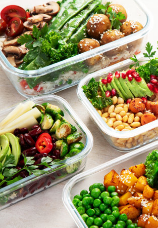 Preparing healthy meals for vegans. Food and snacks in containers on a light background. Top view.の写真素材