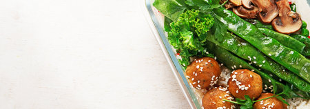 Colorful meal prep containers filled with healthy vegan meal. top view, flat lay, copy spaceの写真素材