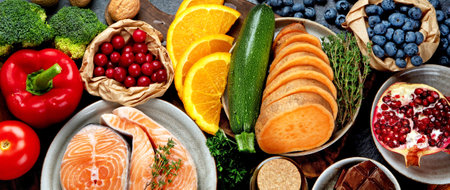 Anti aging menu on dark gray background. High in antioxidants, minerals and vitamins. Top view, flat lay, copy spaceの写真素材