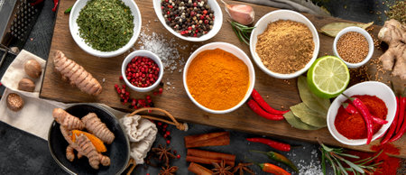 Assortment of spices on gray background. Traditional seasoning concept. Top view, flat layの写真素材