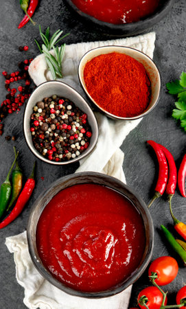 Spicy hot chilli tomato sauce Traditional hot sauce concept. Top view, flat lay,の写真素材