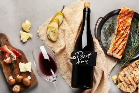 Pinot Noir on gray background. Traditional alcohol drinks. Red wine variety. Top view, flat lay, copy spaceの写真素材