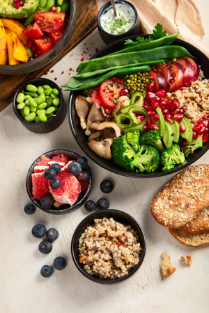 Buddha bowls of mixed vegetables for vegans on a light background. Healthy eating concept. Top view.の写真素材