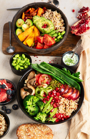Buddha bowls of mixed vegetables for vegans on a light background. Healthy eating concept. Top view.の写真素材