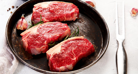 Fresh meat steak on light background. Top viewの写真素材