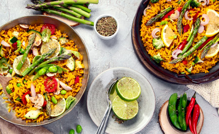 Vegan Paella on gray background. Mediterranean diet. Healthy food concept. Flat lay, top viewの写真素材