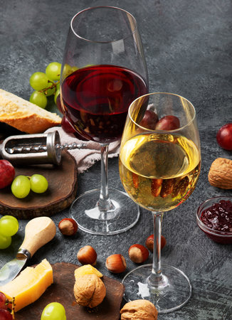 Red wine with appetizers. Summer drink for party, wine shop or wine tasting concept.の写真素材