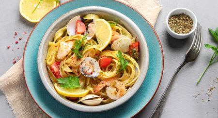 Pasta with seafood on gray background. Traditional Italian Food concept. Top view, flat layの写真素材