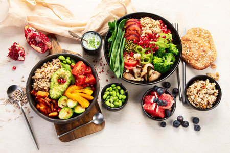Buddha bowls of mixed vegetables for vegans on a light background. Healthy eating concept. Top view.の写真素材