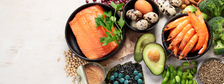 Food rich in omega 3 fatty acid and healthy fats on a light background. Healthy keto and low carb diet eating concept. Top view. Panorama with copy space.の写真素材