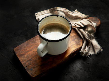 Retro vintage Cup of black coffee. Hot beverage.の写真素材