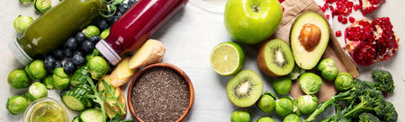 Assorted detox smoothie juices on light background. Healthy diet concept. Delicious vegetables and fruits. Top view. Panorama.の写真素材