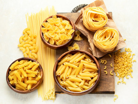 Variety of Italian pasta on light background. Traditional food concept. Top view.の写真素材