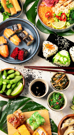 Japanese food assortment on light background. Traditional food concept. Dishes and appetizers. Top view.の写真素材