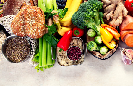 Food lot of carbs on light background. Selection of good sources of carbs. Healthy food concept. Top view. Panorama with copy space.の写真素材