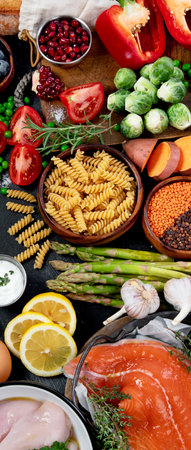Healthy food selection on dark background. Ingredients for cooking. Detox and clean diet concept. Foods high in vitamins, minerals and antioxidants. Anti age foods. Top view.の写真素材