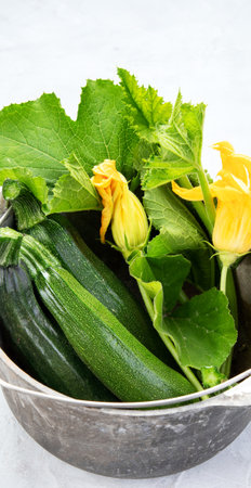 Composition with zucchini on a white background. Popular component of healthy diets.の写真素材