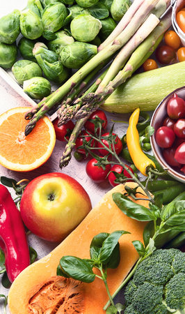 Vegetables and fruits. High in antioxidants, vitamins and fiber for vegans and vegetarians. Healthy food concept. Top view.の写真素材