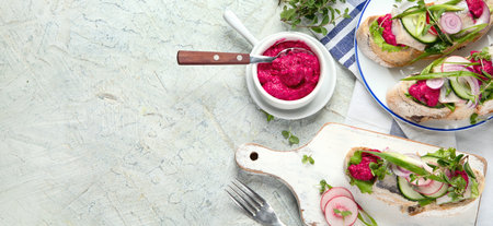 Smorrebrod, traditional Danish open face sandwiches on a gray background. Top view. Panorama with copy space.の写真素材