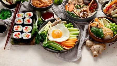 Korean traditional food. Bibimbap, traditional Korean dish, rice, vegetables, Kimchi on a white background. Top view. Copy space.の写真素材