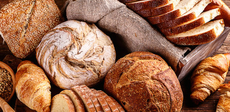Fresh bread on rustic wooden backgroundの写真素材
