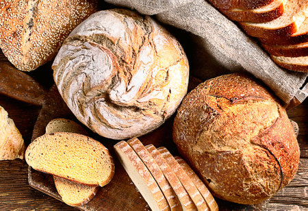 Fresh bread on rustic wooden backgroundの写真素材
