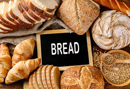 Fresh bread on rustic wooden backgroundの写真素材