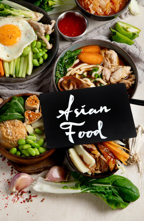 Korean traditional food. Bibimbap, traditional Korean dish, rice, vegetables, Kimchi on a white background. Top view.の写真素材