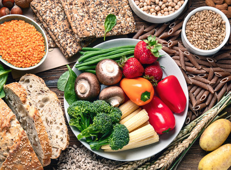 Healthy high fiber diet eating concept with antioxidants and vitamins on a wooden backgrund. Top view.の写真素材