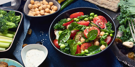 Vegetarian variety dishes on a black background. Healthy vegan food. Clean food and eating concept....