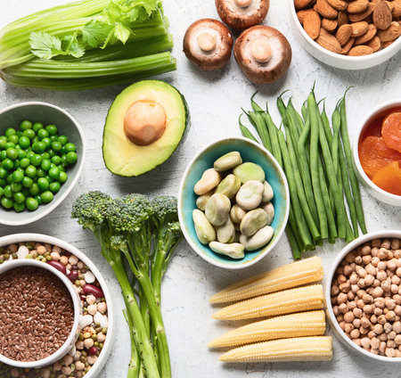 Food sources of plant based protein. Healthy diet with legumes, dried fruit, seeds, nuts and vegetables. Foods high in protein, antioxidants, vitamins and fiber. Top view.の写真素材