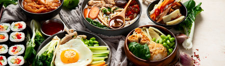 Korean traditional food. Bibimbap, traditional Korean dish, rice, vegetables, Kimchi on a white background. Top view. Panorama with copy space.の写真素材
