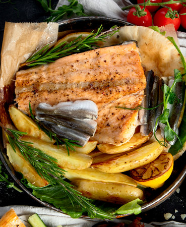 Assortment of various Mediterranean food - fish, seafood, sauces, pasta, snacks on a black background. Top view.の写真素材