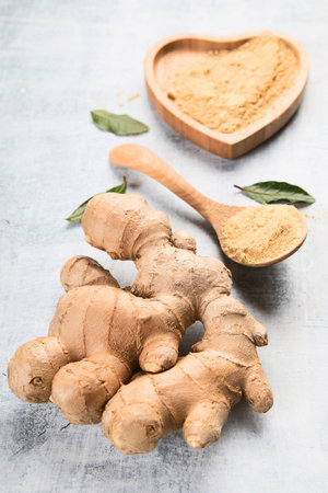 Fresh ginger root on a gray background. Top view.の写真素材