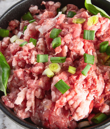 Raw minced meat on a gray background. Top view.の写真素材