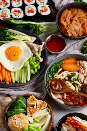 Korean traditional food. Bibimbap, traditional Korean dish, rice, vegetables, Kimchi on a white background. Top view.の写真素材
