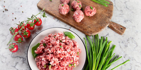 Raw meat balls on a gray background. Cooking and eating concept. Top view. Panorama.の写真素材