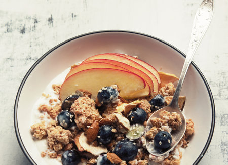Bowl of granola with yogurt and fresh fruits for healthy breakfast. Top view. Panorama.の写真素材