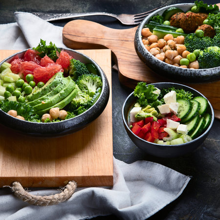 Healthy vegetarian dinner table setting on a gray background. Healthy cooking concept. Clean eating, vegan food. Top view.の写真素材